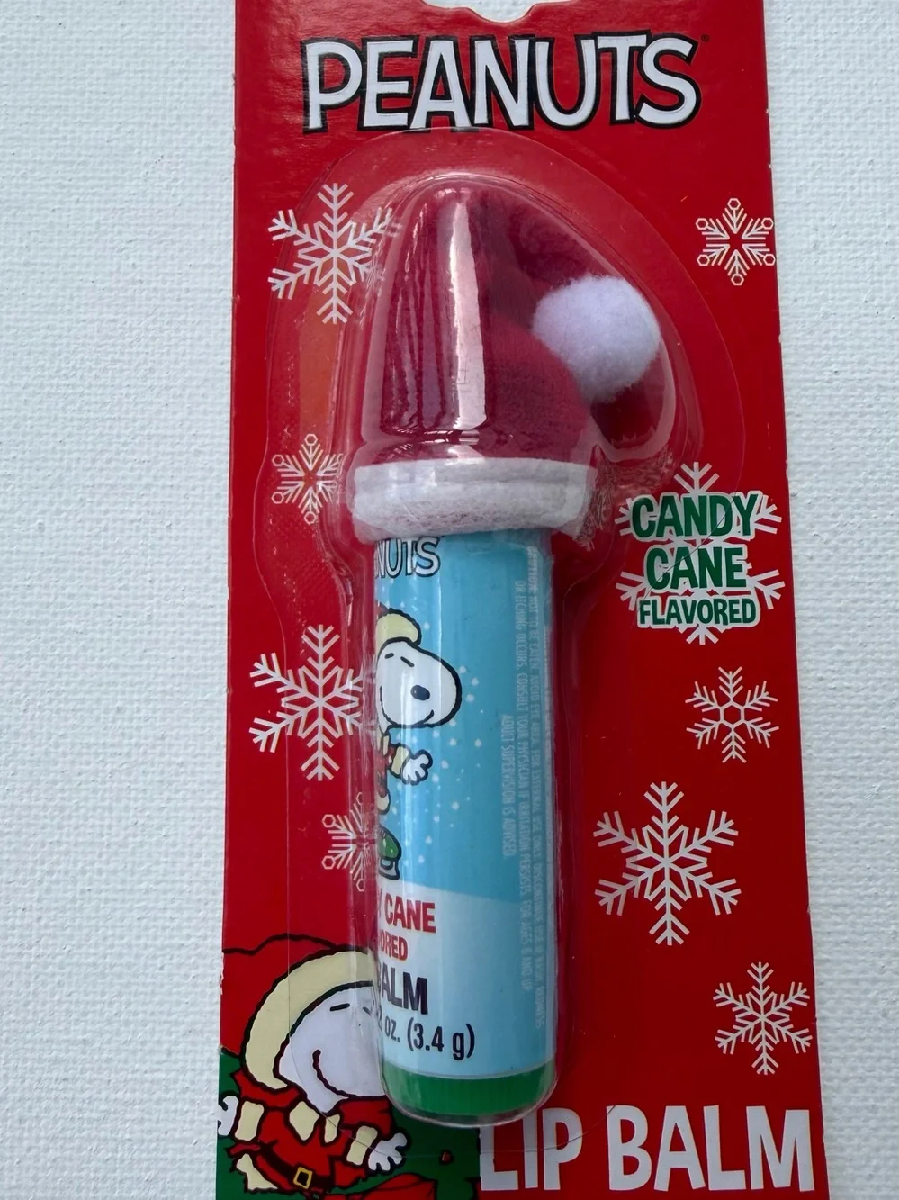 Peanuts Candy Cane Lip Balm with Snoopy Holiday Hat - Red, White, Blue, Green